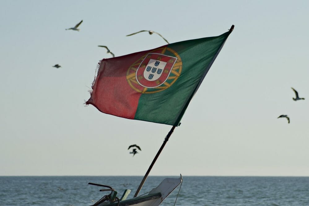 green red and yellow flag on boat during daytime