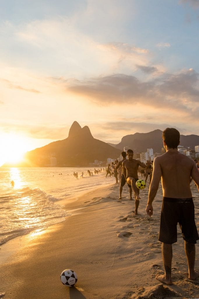 people at the beach during golden hour